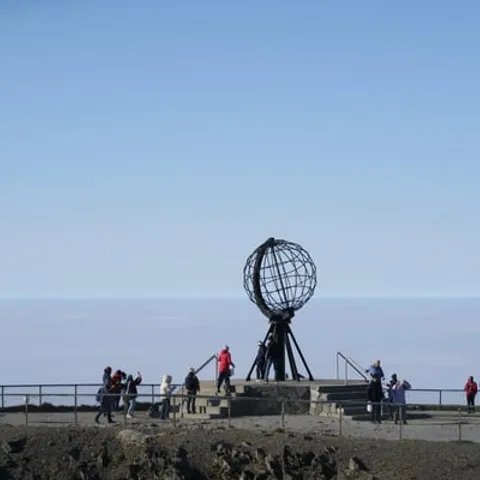 Visitors at the globe monument on the North Cape plateau