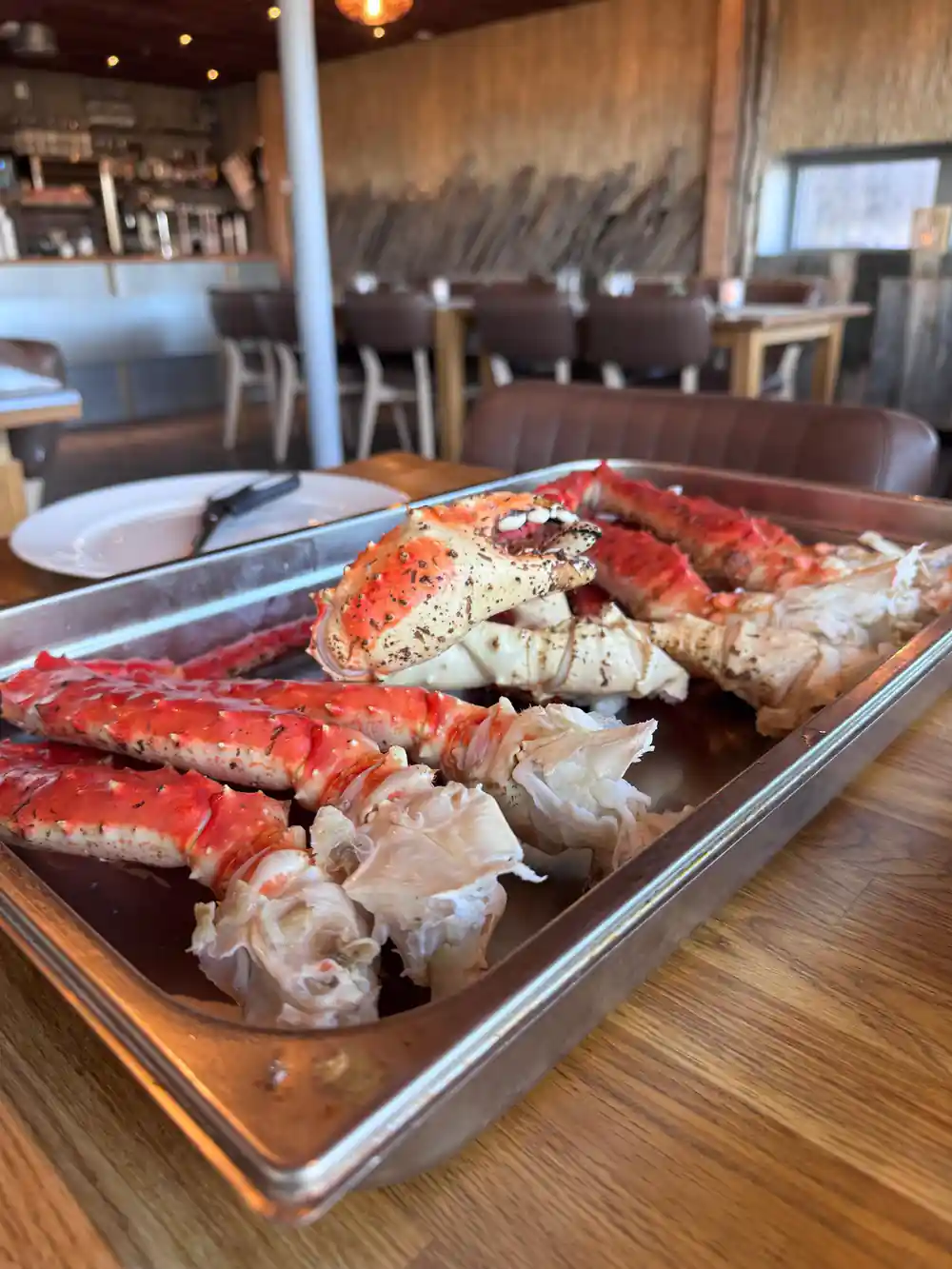 A serving tray of crab legs in the boathouse dining room